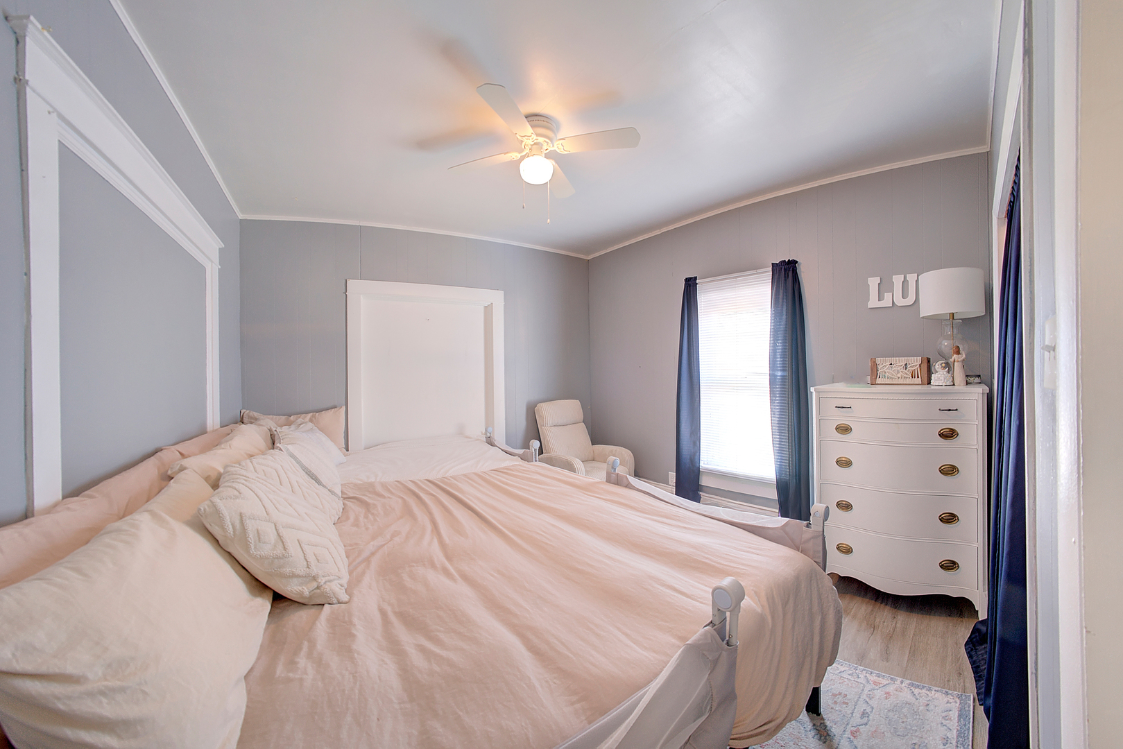 118 East 11th Street Lockport, IL 60441 - Photo 20 of 30 a bedroom with a bed and a chandelier