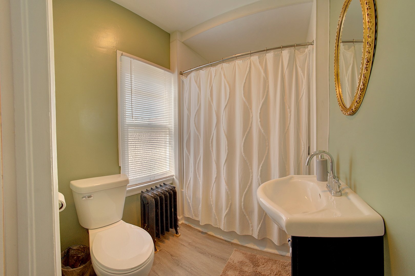 118 East 11th Street Lockport, IL 60441 - Photo 21 of 30 a bathroom with a toilet a sink and a mirror