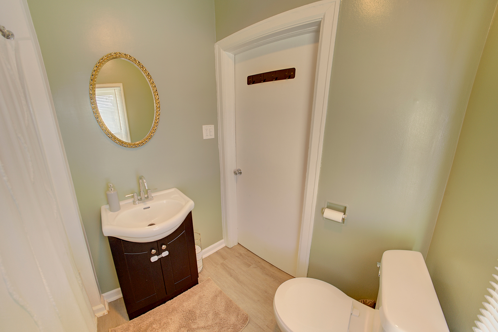 118 East 11th Street Lockport, IL 60441 - Photo 23 of 30 a bathroom with a toilet sink and mirror