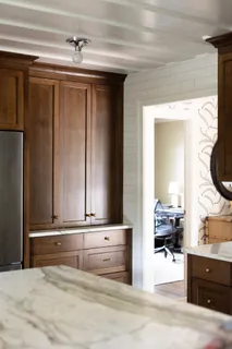 a kitchen with a sink stove and cabinets