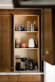 a living room with furniture a fireplace and a large window