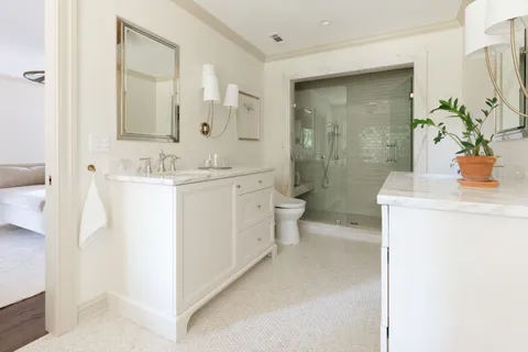 a bathroom with a shower and toilet