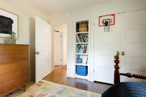 a bedroom with bed and a window