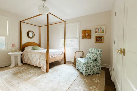 a view of a livingroom with workspace and a window
