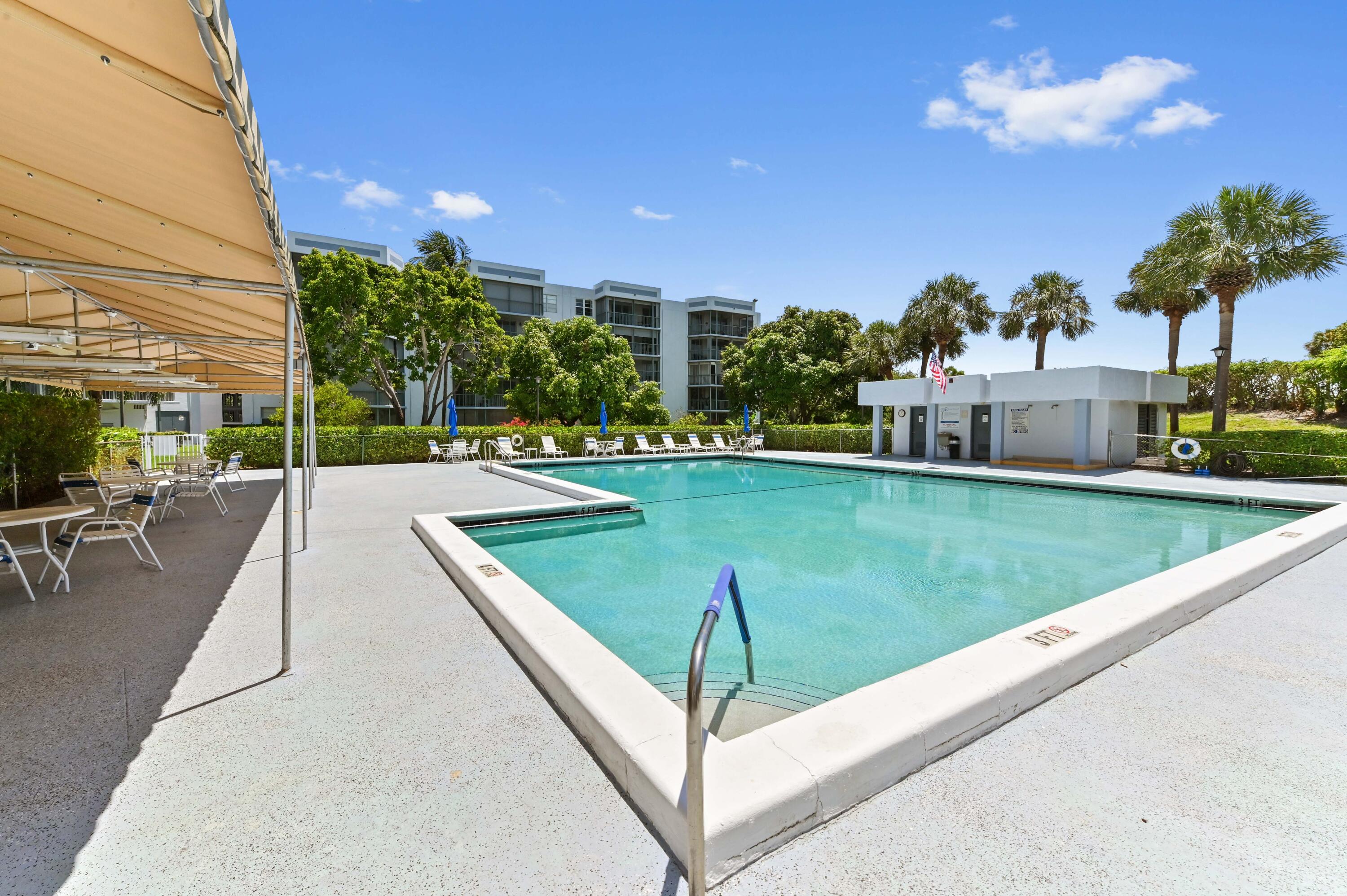 6400 Northwest 2nd Avenue, Unit 124 Boca Raton, FL 33487 - Photo 30 of 33 a view of a swimming pool with a patio