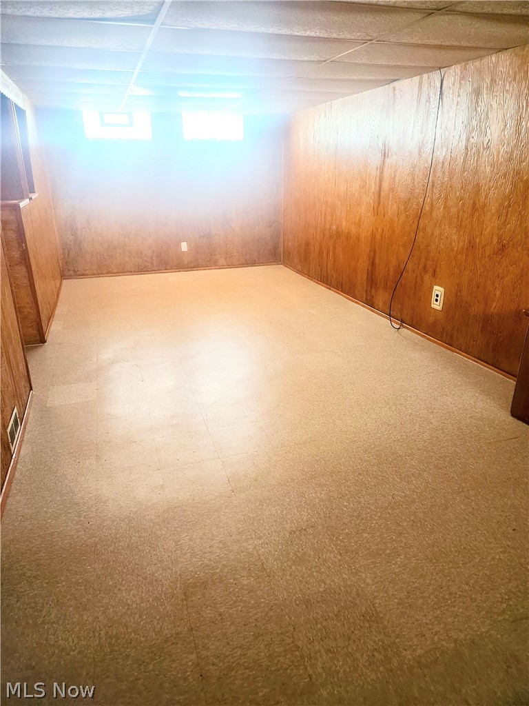15901 Turney Road Maple Heights, OH 44137 - Photo 14 of 22 Finished rec room with paneling and linoleum floor