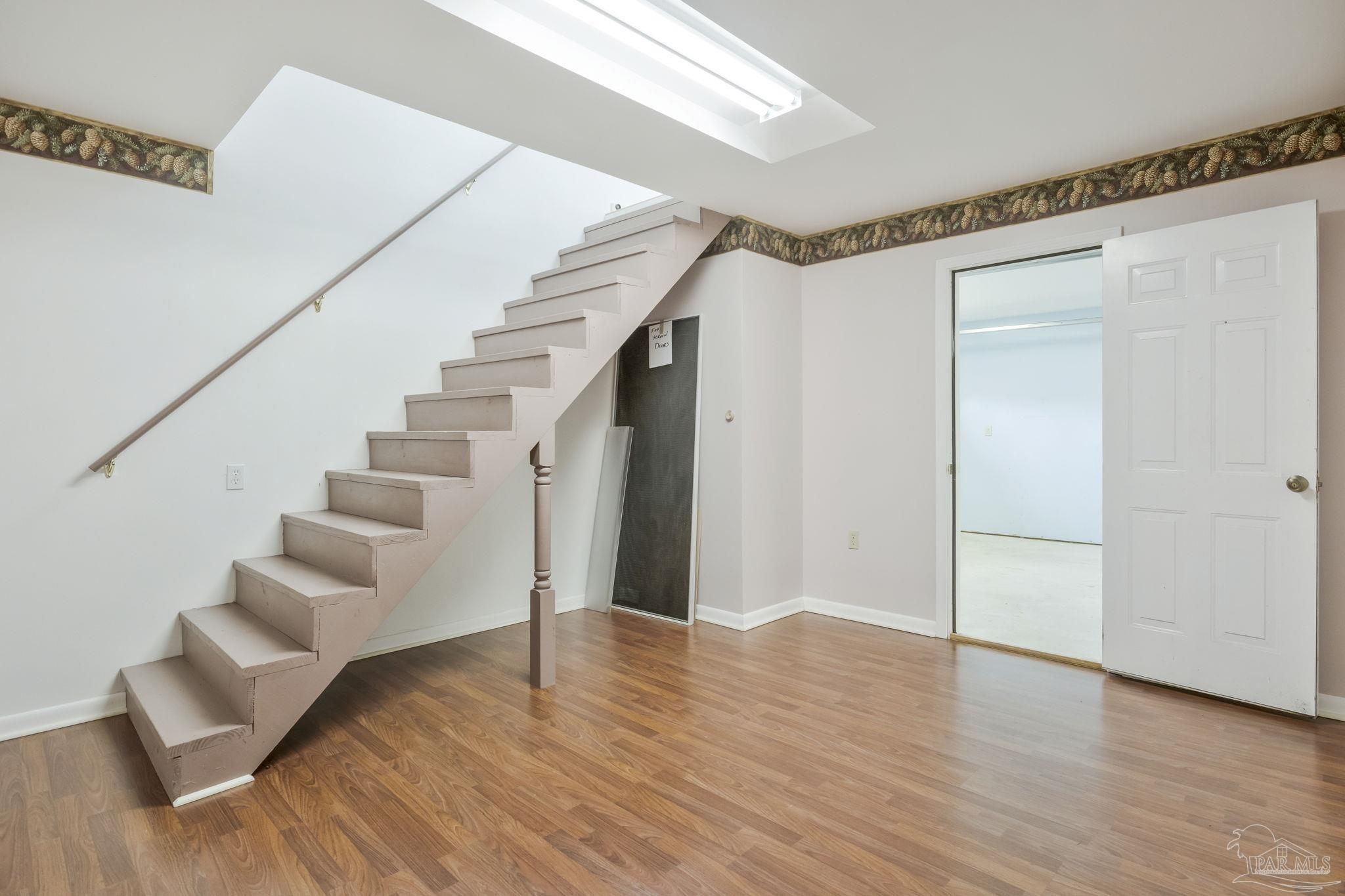 4411 Pace Lane Pace, FL 32571 - Photo 26 of 68 a view of an entryway with wooden floor