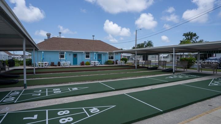 3301 Alt 19 Palm Harbor, Unit 317 Palm Harbor, FL 34683 - Photo 12 of 48 a view of a swimming pool with a patio