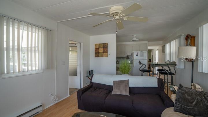 3301 Alt 19 Palm Harbor, Unit 317 Palm Harbor, FL 34683 - Photo 23 of 48 a living room with furniture and a window