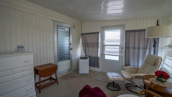 3301 Alt 19 Palm Harbor, Unit 317 Palm Harbor, FL 34683 - Photo 25 of 48 a living room with furniture and a window
