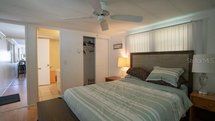 3301 Alt 19 Palm Harbor, Unit 317 Palm Harbor, FL 34683 - Photo 26 of 48 a bedroom with a bed and a walk in closet
