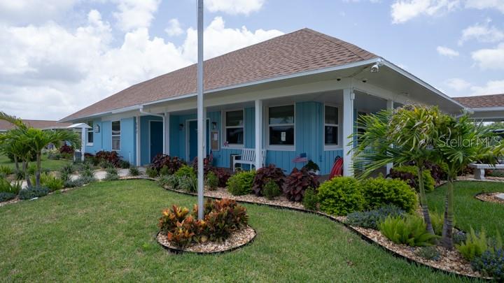 3301 Alt 19 Palm Harbor, Unit 317 Palm Harbor, FL 34683 - Photo 29 of 48 a view of a house with a yard and plants