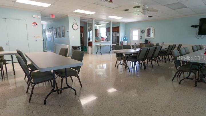 3301 Alt 19 Palm Harbor, Unit 317 Palm Harbor, FL 34683 - Photo 31 of 48 a view of a dining area with furniture