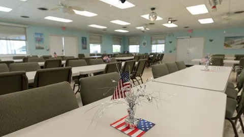 a view of a park that has a sign board