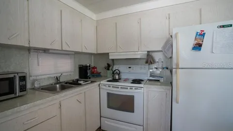 a bedroom with a bed and a table in it