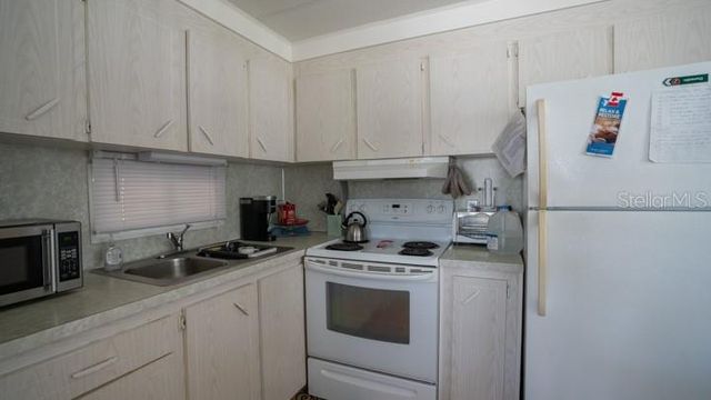 a bedroom with a bed and a table in it