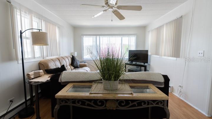 3301 Alt 19 Palm Harbor, Unit 317 Palm Harbor, FL 34683 - Photo 8 of 48 a view of a dining room with furniture and window