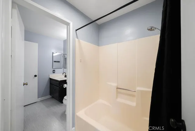 a bathroom with a bathtub and a shower