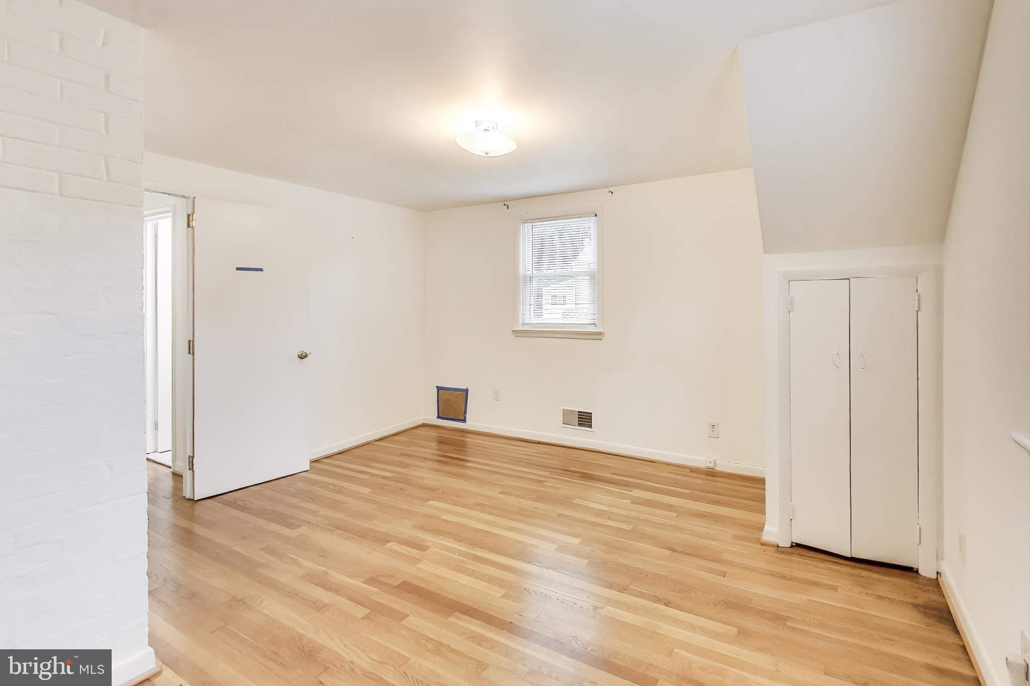 10019 Greenock Road Silver Spring, MD 20901 - Photo 22 of 39 a view of empty room with wooden floor