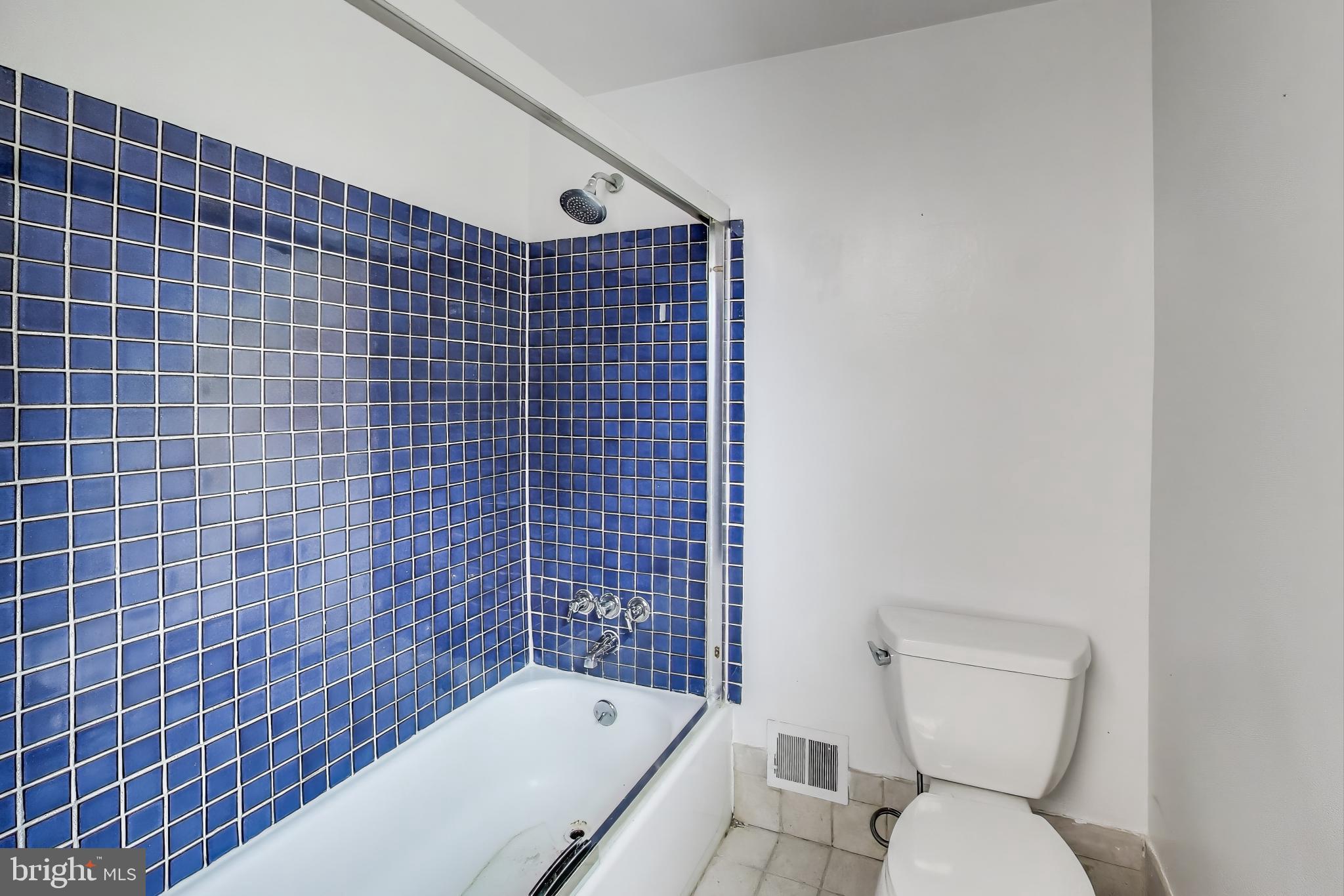 10019 Greenock Road Silver Spring, MD 20901 - Photo 24 of 39 a bathroom with a toilet and a bathtub