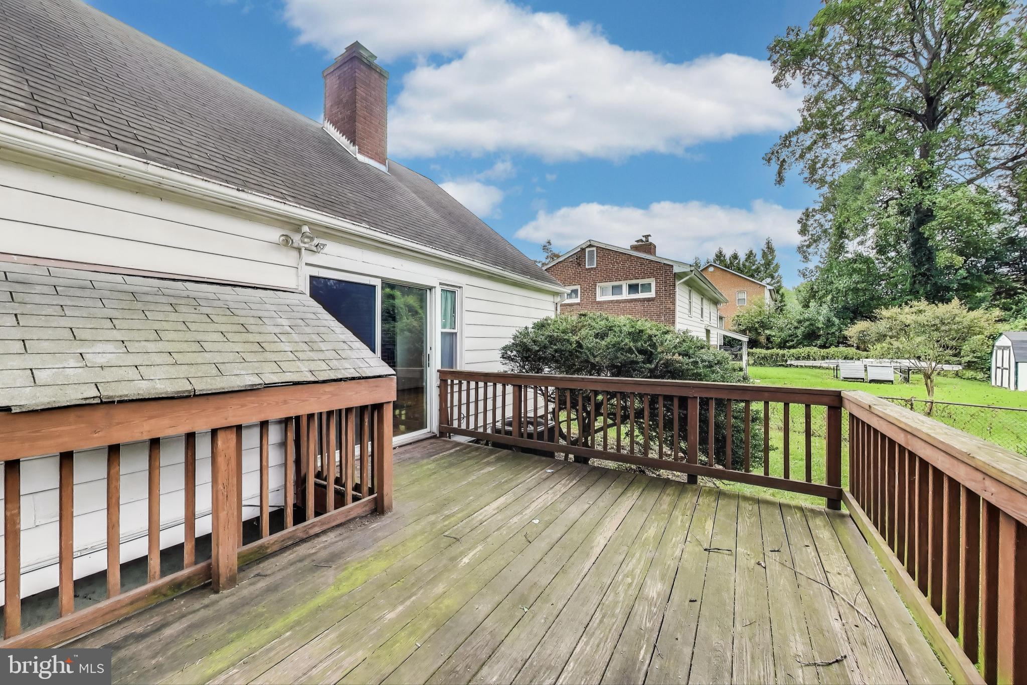 10019 Greenock Road Silver Spring, MD 20901 - Photo 33 of 39 a view of a roof deck with wooden floor and fence
