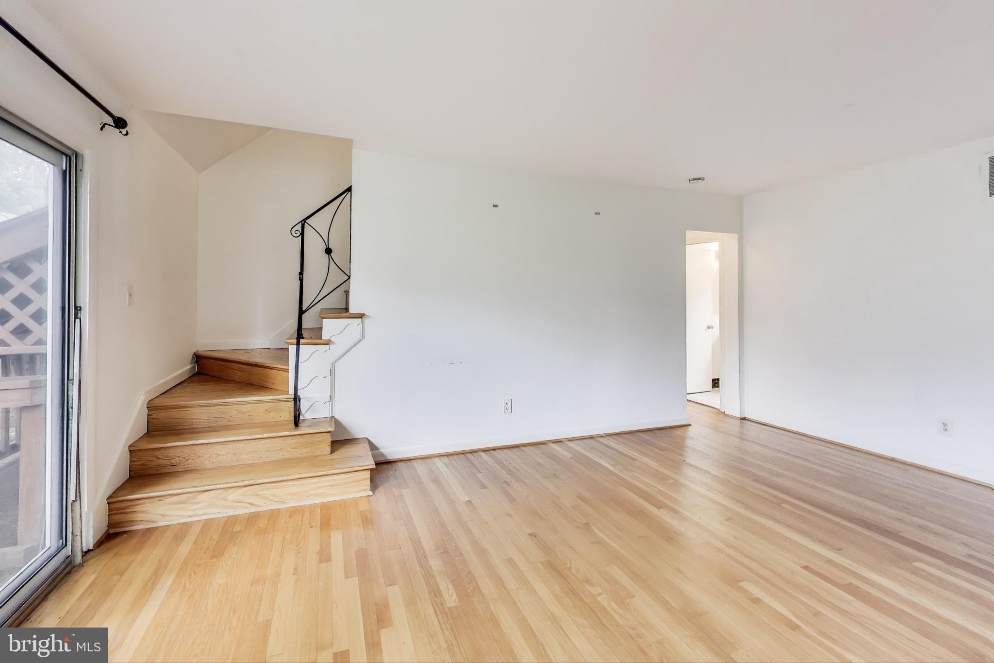 10019 Greenock Road Silver Spring, MD 20901 - Photo 7 of 39 a view of entryway with wooden floor and stairs