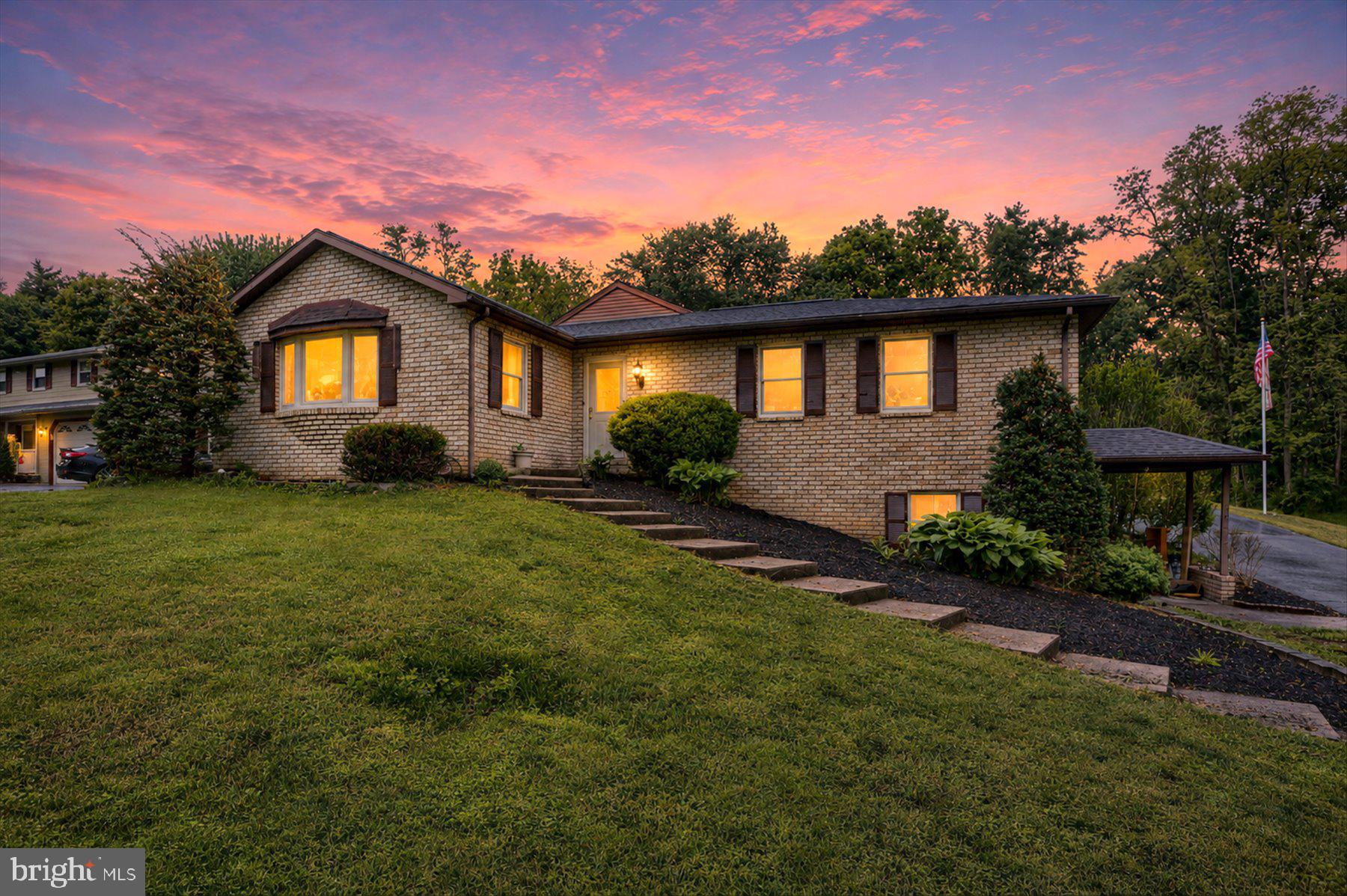 12 South Ridge Road Boiling Springs, PA 17007 - Photo 1 of 39 a front view of a house with a yard and garage