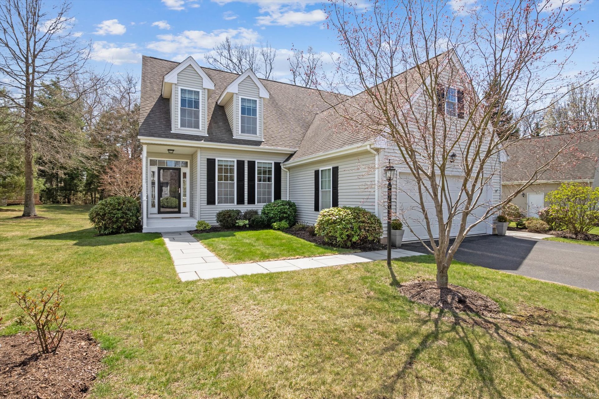 2 Kenington Road, Unit 2 Avon, CT 06001 - Photo 1 of 1 a front view of a house with a yard and garage