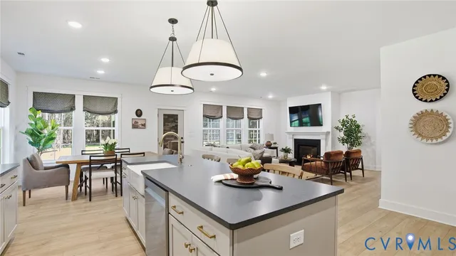 a living room with fireplace furniture and a table