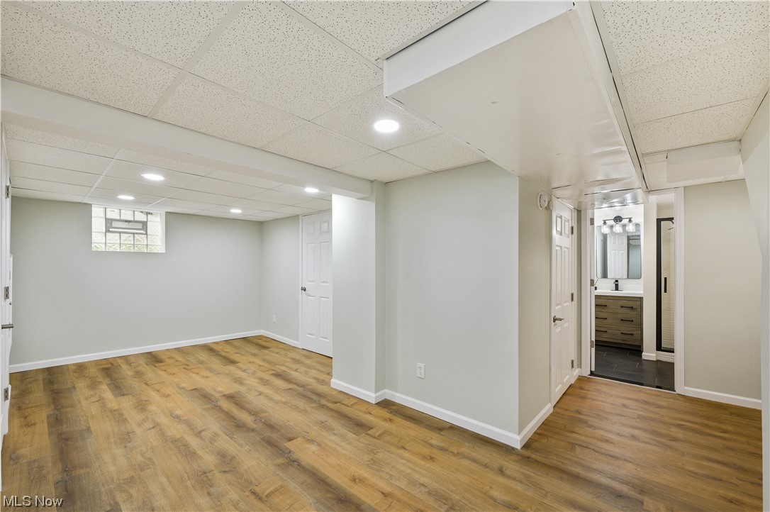 1606 Maple Road Cleveland Heights, OH 44121 - Photo 24 of 30 Partially finished basement offers options for family/recreation room or working space and renovated full bathroom(2023) with walk-in shower, sliding shower door and single vanity
