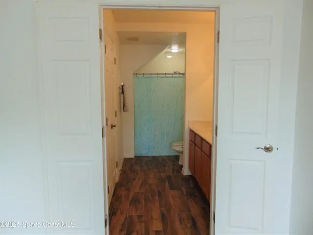 a view of a bathroom with a sink and a mirror
