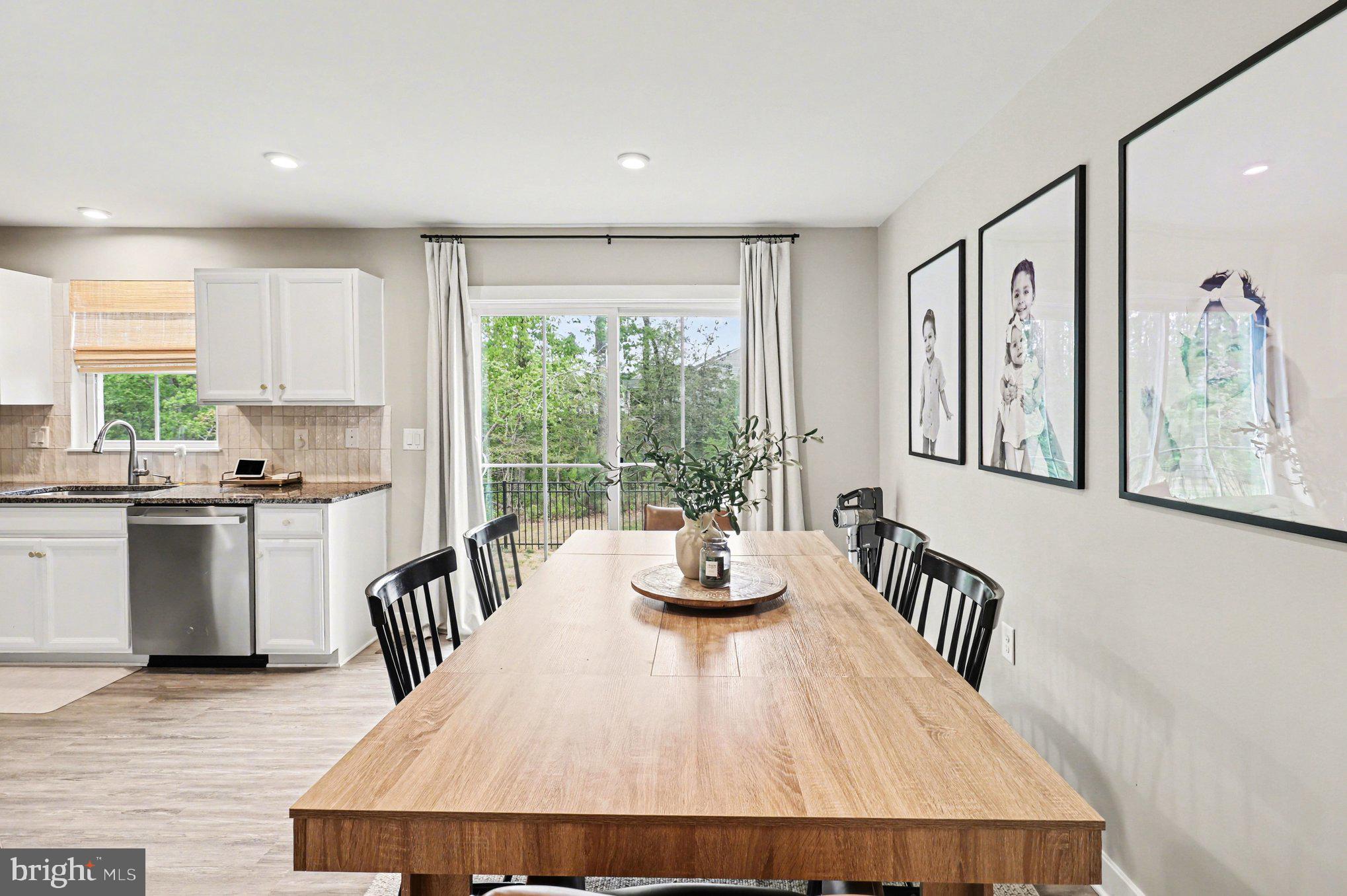 7202 Parchment Circle Ruther Glen, VA 22546 - Photo 5 of 30 a kitchen with a table chairs dining table and a large window
