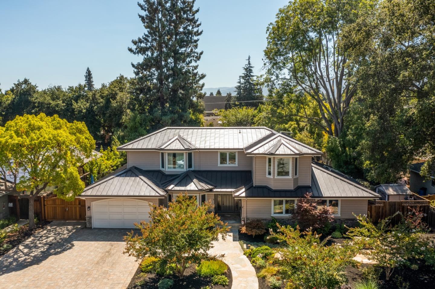 714 Arroyo Road Los Altos, CA 94024 - Photo 1 of 42 a front view of a house with a garden