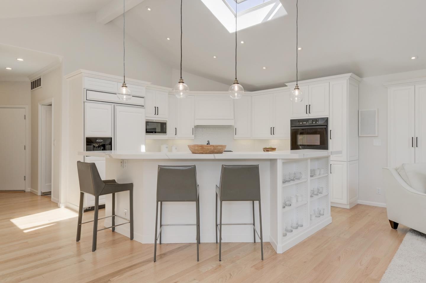 714 Arroyo Road Los Altos, CA 94024 - Photo 12 of 42 a kitchen with kitchen island white cabinets and stainless steel appliances