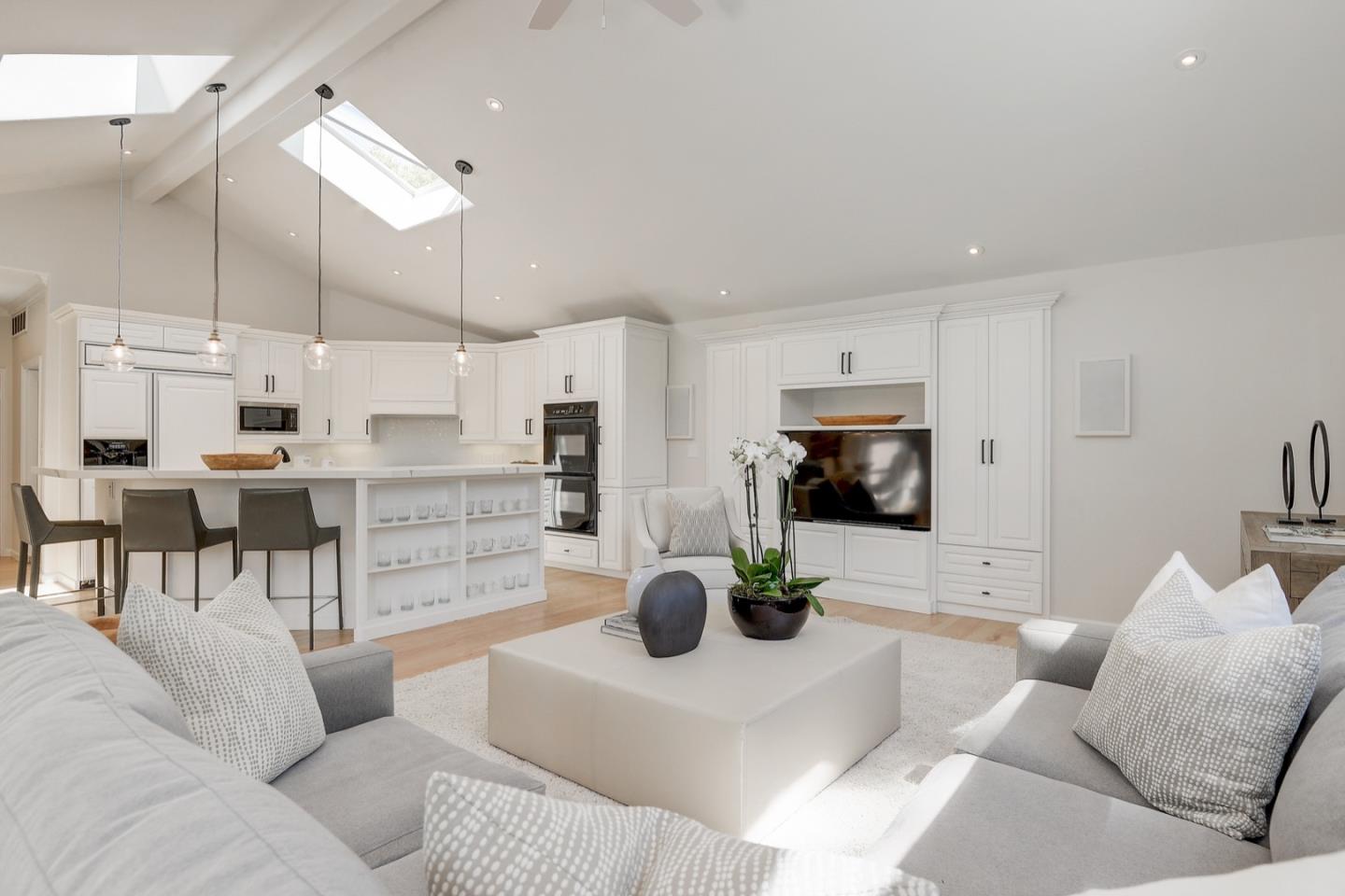 714 Arroyo Road Los Altos, CA 94024 - Photo 13 of 42 a living room with stainless steel appliances kitchen island granite countertop a couch and a view of living room