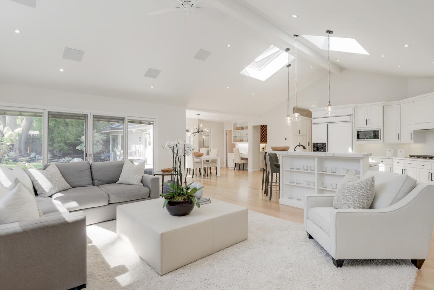 714 Arroyo Road Los Altos, CA 94024 - Photo 18 of 42 a living room with furniture kitchen view and a large window