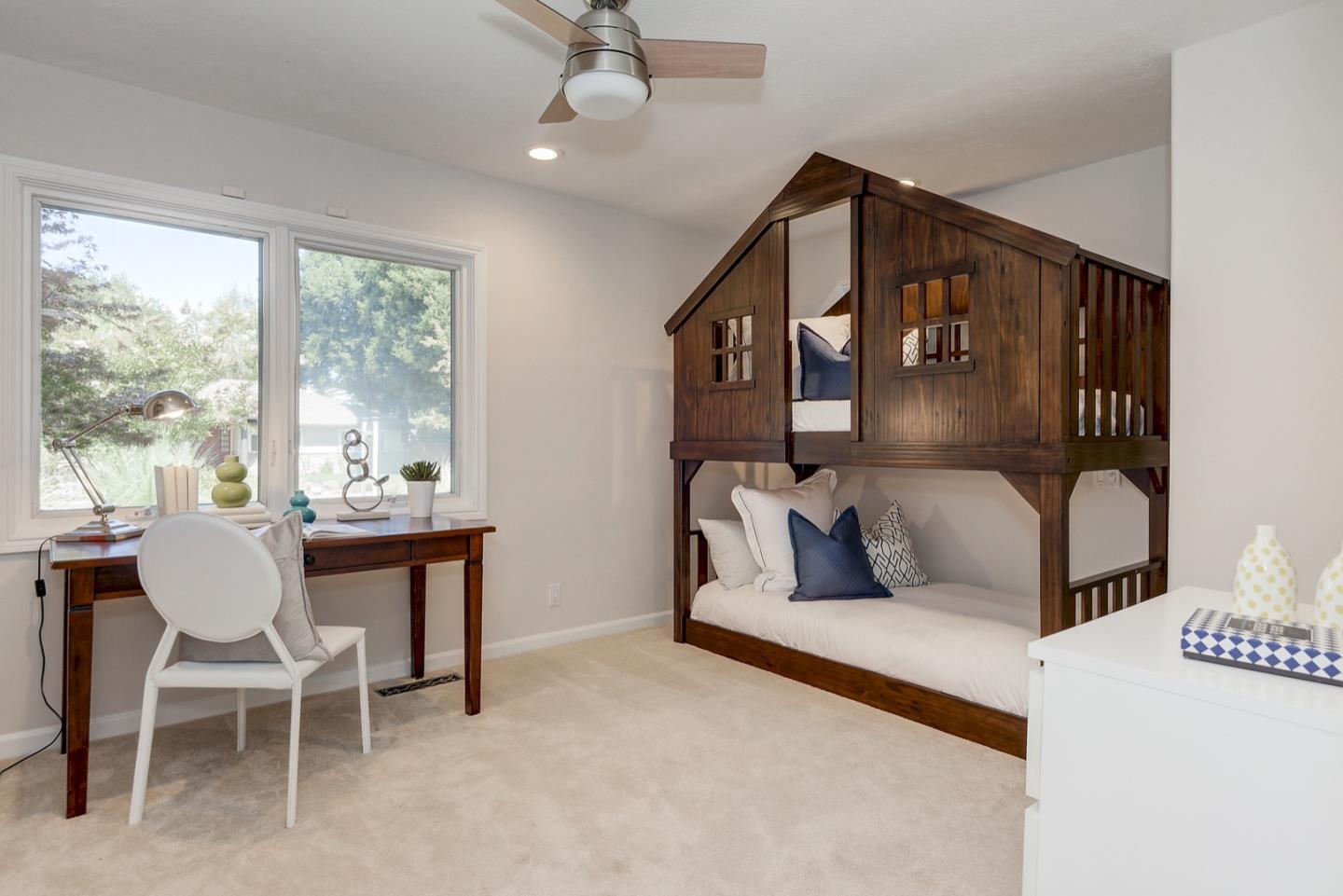 714 Arroyo Road Los Altos, CA 94024 - Photo 22 of 42 a living room with furniture and a large window