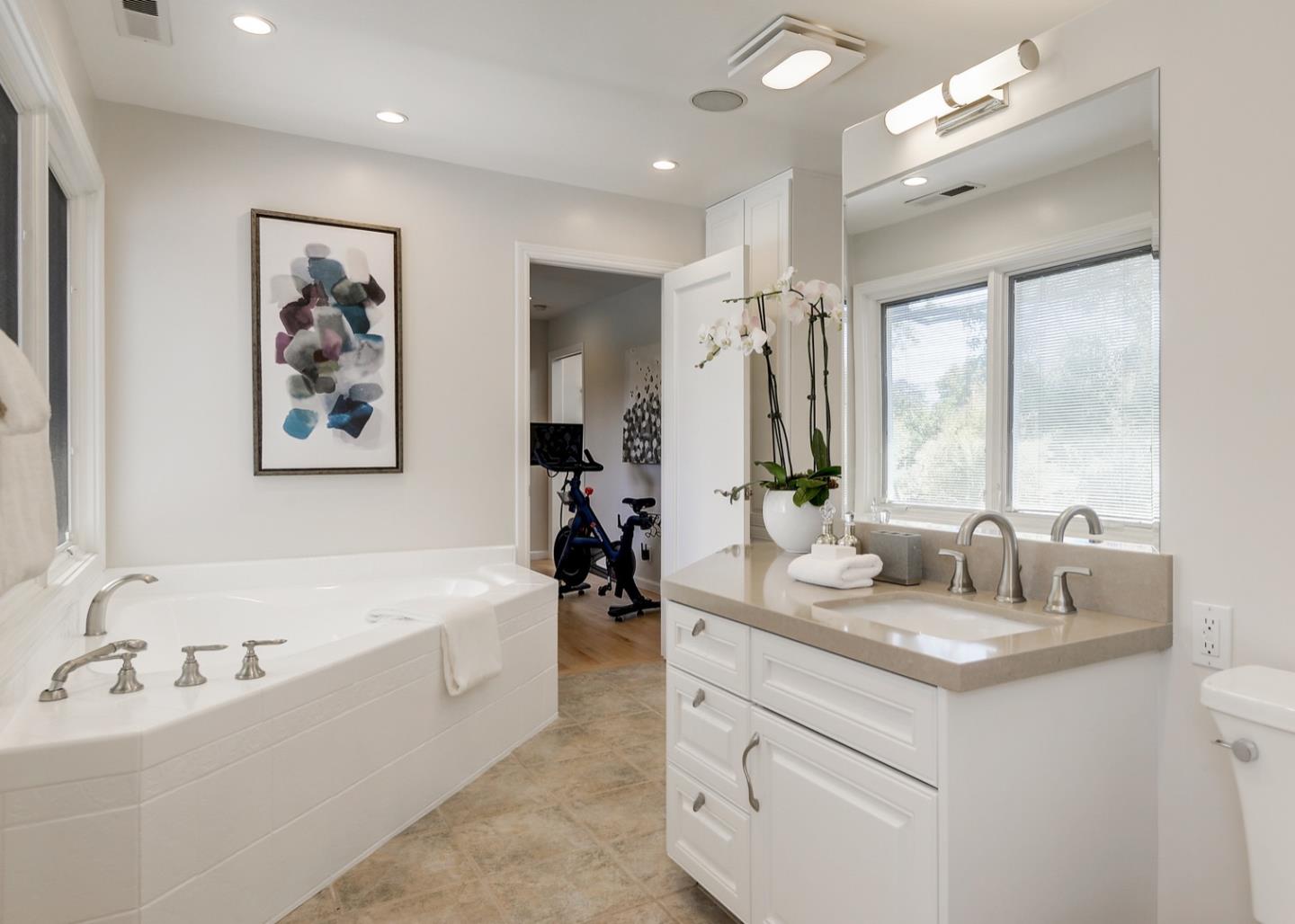 714 Arroyo Road Los Altos, CA 94024 - Photo 30 of 42 a bathroom with a bathtub double sink and mirror