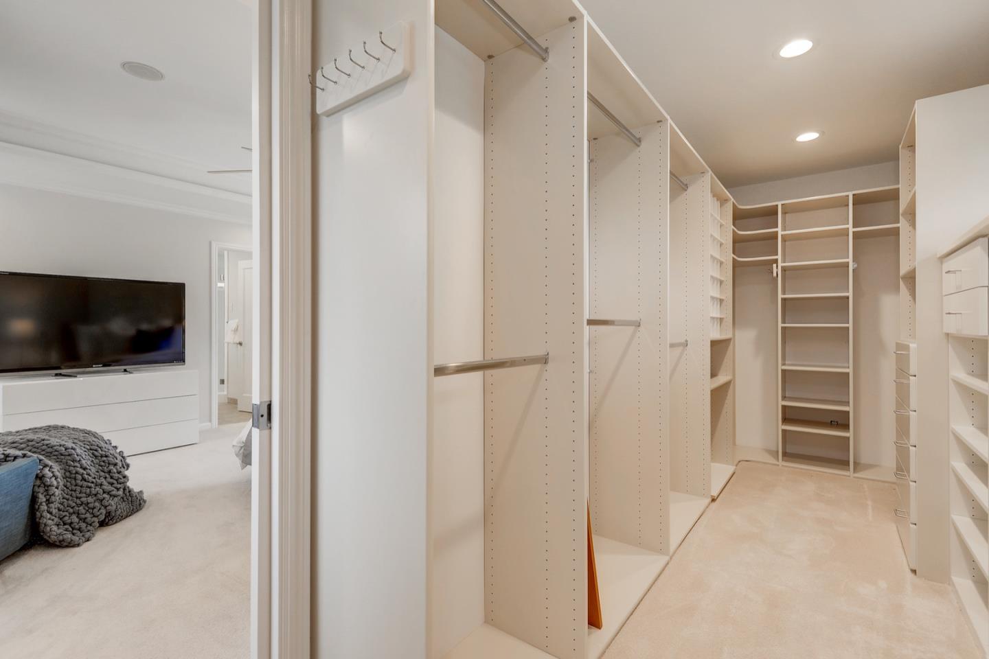 714 Arroyo Road Los Altos, CA 94024 - Photo 31 of 42 a view of walk in closet with clothes and shoes