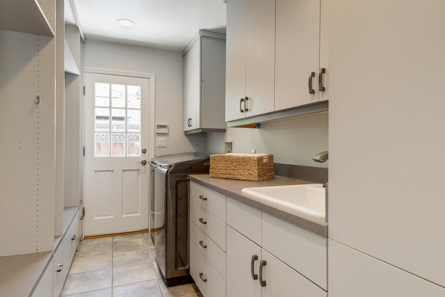 714 Arroyo Road Los Altos, CA 94024 - Photo 34 of 42 a kitchen with a sink and cabinets