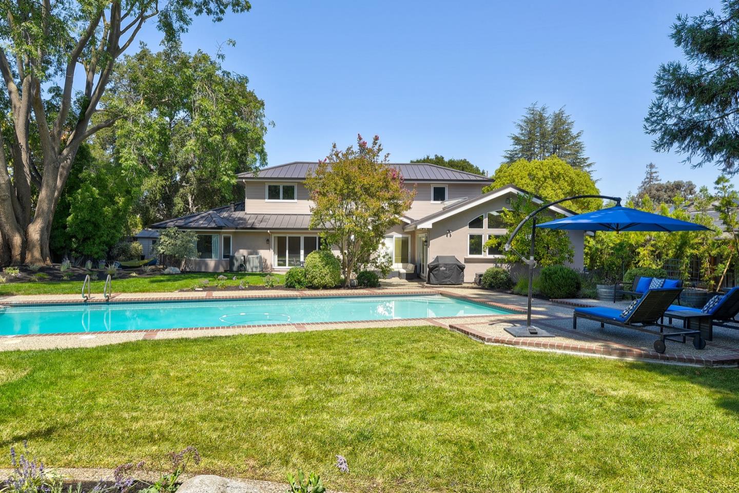 714 Arroyo Road Los Altos, CA 94024 - Photo 39 of 42 a view of pool with lawn chairs and large trees