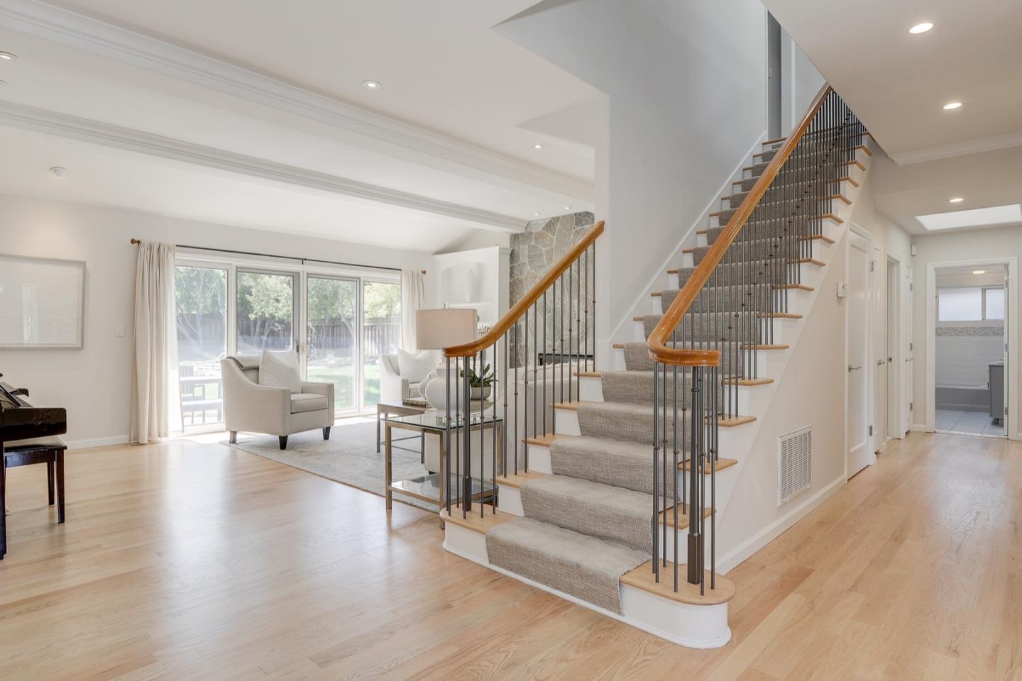 714 Arroyo Road Los Altos, CA 94024 - Photo 4 of 42 a view of entryway with wooden floor and windows