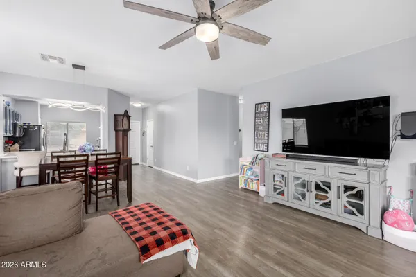 a view of a dining room with furniture and a livingroom