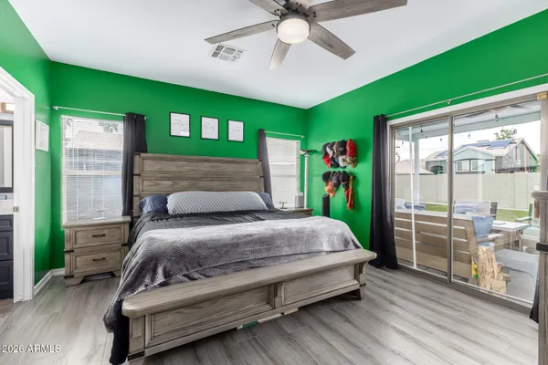 a bedroom with a bed and a dresser