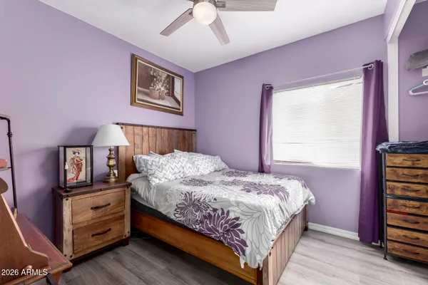 a bedroom with a large bed and a closet