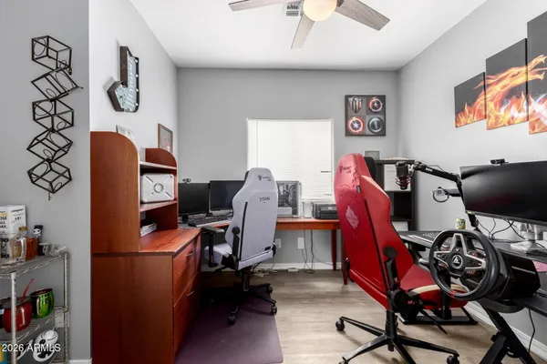 a view of workspace with furniture and wooden floor