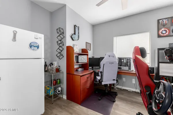 a bedroom with a bed and a dresser