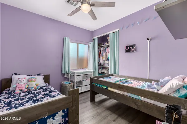 a bedroom with a bed and dresser