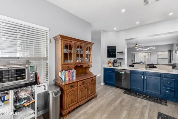 a kitchen with stainless steel appliances granite countertop a stove and a wooden cabinets