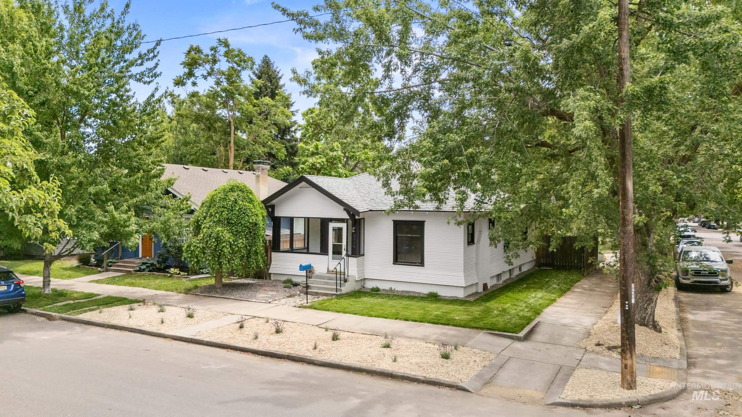 2119 West Brumback Street Boise, ID 83702 - Photo 2 of 30 White exterior with black trim and a gabled roof